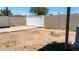 Wide backyard with partial patio and block fence for privacy at 3802 W Mulberry Dr, Phoenix, AZ 85019