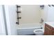 Standard bathroom with a shower-tub combo, commode, and a modern vanity at 3802 W Mulberry Dr, Phoenix, AZ 85019