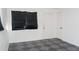 Bedroom featuring white walls, decorative tile flooring, and a window with blinds at 3802 W Mulberry Dr, Phoenix, AZ 85019