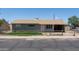 Single story home with neutral siding, brown roof, chain link fence, and covered carport at 3802 W Mulberry Dr, Phoenix, AZ 85019