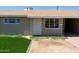 Close up of the front entrance featuring faux grass and an arid lawn at 3802 W Mulberry Dr, Phoenix, AZ 85019