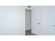 Hallway featuring white doors, black hardware, light walls and wood look floors at 3802 W Mulberry Dr, Phoenix, AZ 85019