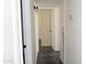 Hallway features classic tile flooring, built-in shelving and neutral walls at 3802 W Mulberry Dr, Phoenix, AZ 85019