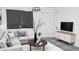 Bright living room featuring a comfortable sectional sofa and stylish decor at 3802 W Mulberry Dr, Phoenix, AZ 85019