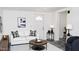 Cozy living room showcasing a stylish white sofa with plaid pillows at 3802 W Mulberry Dr, Phoenix, AZ 85019
