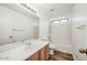 Clean bathroom with a shower-tub combo, and wood cabinets at 4144 N 109Th Ave, Phoenix, AZ 85037