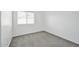 Simple bedroom with a carpet and window at 4144 N 109Th Ave, Phoenix, AZ 85037