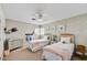 Bright bedroom features twin beds, wall decor, neutral carpet, and natural light from the window at 4243 E Avalon Dr, Phoenix, AZ 85018