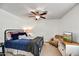 Bedroom with a ceiling fan, a bed, and a sitting chair and table at 4243 E Avalon Dr, Phoenix, AZ 85018