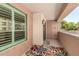 Cozy balcony with outdoor rug, offering a private spot with building views and fresh air at 4803 N Woodmere Fairway -- # 1002, Scottsdale, AZ 85251