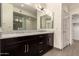 Luxurious bathroom featuring double sinks, granite countertops, and modern fixtures at 4803 N Woodmere Fairway -- # 1002, Scottsdale, AZ 85251