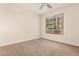 Neutral-toned bedroom with plush carpeting, and large window, perfect for relaxation at 4803 N Woodmere Fairway -- # 1002, Scottsdale, AZ 85251