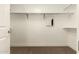 Spacious walk-in closet offering ample storage space with shelving and hanging rods at 4803 N Woodmere Fairway -- # 1002, Scottsdale, AZ 85251