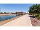 Community walking path along side canal with residential housing in background at 4803 N Woodmere Fairway -- # 1002, Scottsdale, AZ 85251
