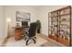 Functional home office with modern desk, shelving, and comfortable executive chair at 4803 N Woodmere Fairway -- # 1002, Scottsdale, AZ 85251