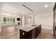 Elegant kitchen with a large island, stainless steel appliances, and an open floor plan at 4803 N Woodmere Fairway -- # 1002, Scottsdale, AZ 85251