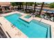 Relaxing pool area with lounge chairs, palm trees, and the community name at The Sage at 4803 N Woodmere Fairway -- # 1002, Scottsdale, AZ 85251