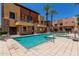 Gorgeous community pool and hot tub surrounded by two story condo building at 4803 N Woodmere Fairway -- # 1002, Scottsdale, AZ 85251