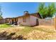 Back of the house with spacious yard, patio, and block wall at 4845 W Sweetwater Ave, Glendale, AZ 85304