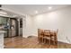 Dining area with hardwood floors and a stainless steel refrigerator at 4845 W Sweetwater Ave, Glendale, AZ 85304
