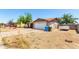 A single story home with a two car garage, long driveway and xeriscaped front yard at 4845 W Sweetwater Ave, Glendale, AZ 85304