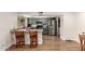 Eat-in kitchen with granite countertops, stainless appliances and wood flooring at 4845 W Sweetwater Ave, Glendale, AZ 85304