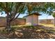 Backyard shed in an enclosed yard with mature landscaping at 4845 W Sweetwater Ave, Glendale, AZ 85304