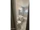 Clean, updated bathroom with marble-look tiles and classic white vanity at 5735 N 32Nd Dr, Phoenix, AZ 85017