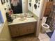 Modest bathroom with a sink, toilet, and vanity, offering functionality at 5735 N 32Nd Dr, Phoenix, AZ 85017