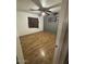 Clean bedroom with wood-look flooring, fan, and a window at 5735 N 32Nd Dr, Phoenix, AZ 85017