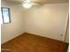Bedroom featuring a ceiling fan, window and wood-look flooring at 5735 N 32Nd Dr, Phoenix, AZ 85017