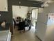 Bright dining room connected to the kitchen, featuring a table and access to the backyard at 5735 N 32Nd Dr, Phoenix, AZ 85017