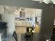 Bright kitchen featuring white cabinetry, neutral countertops, and stainless steel appliances at 5735 N 32Nd Dr, Phoenix, AZ 85017