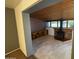 Cozy den area with wood-burning brick fireplace and tile floors at 5735 N 32Nd Dr, Phoenix, AZ 85017
