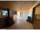 Living room features brick fireplace with wood beam ceiling and plenty of natural light at 5735 N 32Nd Dr, Phoenix, AZ 85017