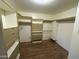 Spacious walk-in closet with built-in shelving and ample storage space for organized clothing and accessories at 5735 N 32Nd Dr, Phoenix, AZ 85017