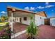 Charming home featuring a well-maintained backyard patio that is paved, complemented by lush landscaping at 5803 W John Cabot Rd, Glendale, AZ 85308
