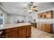 Open-concept dining room leads to kitchen with natural lighting and seamless flow for easy entertaining at 5803 W John Cabot Rd, Glendale, AZ 85308