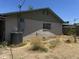 Picture of the rear exterior and backyard of the home at 61 W 11Th Dr, Mesa, AZ 85210