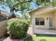Serene backyard with covered patio, mature trees, and a well-maintained lawn at 6376 W Adobe Dr, Glendale, AZ 85308