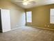 Bright and airy bedroom with neutral carpet and ample natural light through the windows at 6376 W Adobe Dr, Glendale, AZ 85308