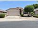 Charming single-story home featuring a manicured front lawn and attached garage at 6376 W Adobe Dr, Glendale, AZ 85308
