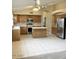 Spacious kitchen features wood cabinets, tile floors, and a functional center island at 6376 W Adobe Dr, Glendale, AZ 85308