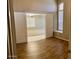 View of office with double door entry and large window, flowing into the main living space at 6376 W Adobe Dr, Glendale, AZ 85308