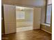 View of office with double door entry and large window, flowing into the main living space at 6376 W Adobe Dr, Glendale, AZ 85308