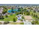 Community aerial view highlighting a park with a lake, walking paths, playgrounds and sport courts at 6415 W Escuda Rd, Glendale, AZ 85308
