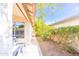 Side yard featuring desert landscaping with gravel and a mature tree offering shade at 6415 W Escuda Rd, Glendale, AZ 85308