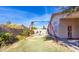 Lush backyard featuring a swing set and well-maintained lawn, ideal for Gathering fun at 6415 W Escuda Rd, Glendale, AZ 85308