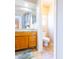 Bright bathroom with a vanity and toilet in a separate room at 6415 W Escuda Rd, Glendale, AZ 85308