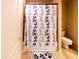 Bathroom with shower-tub combination and a decorative shower curtain at 6415 W Escuda Rd, Glendale, AZ 85308